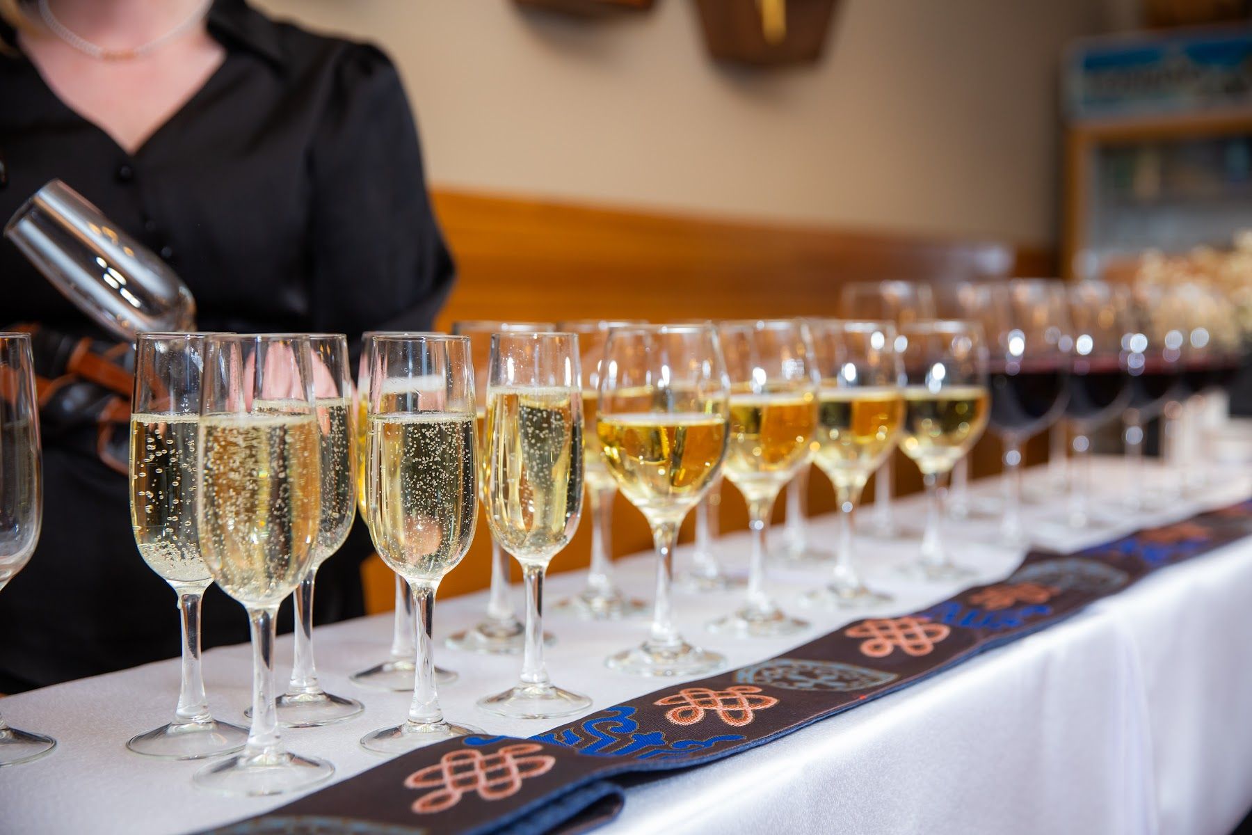 Wine being poured at an event at the lodge