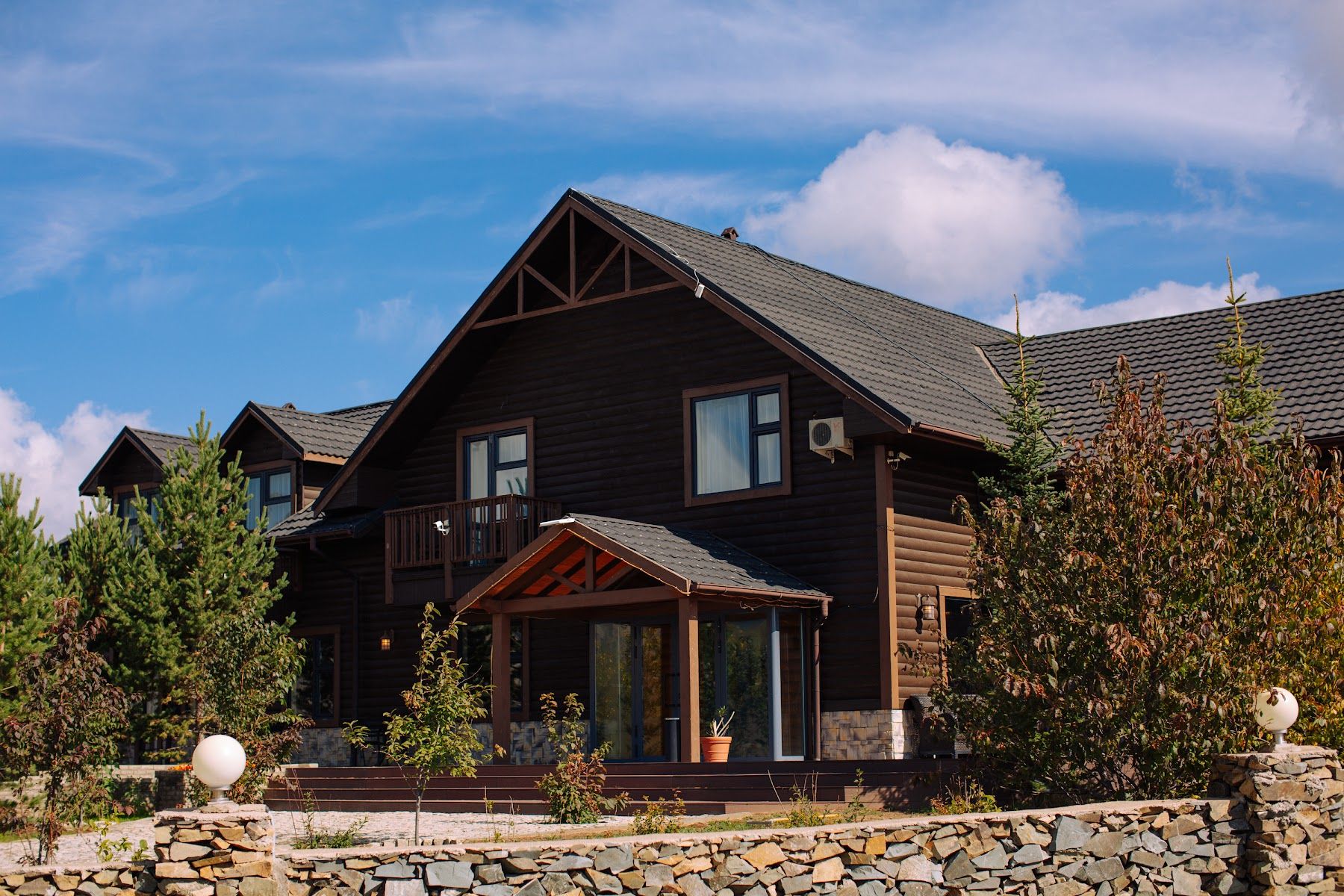 The main lodge building with the hills behind