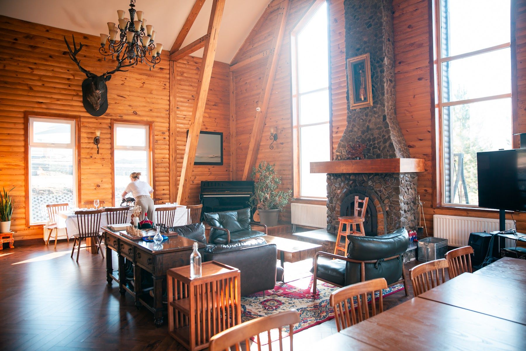 The great hall at Big Sky Lodge with its stone fireplace