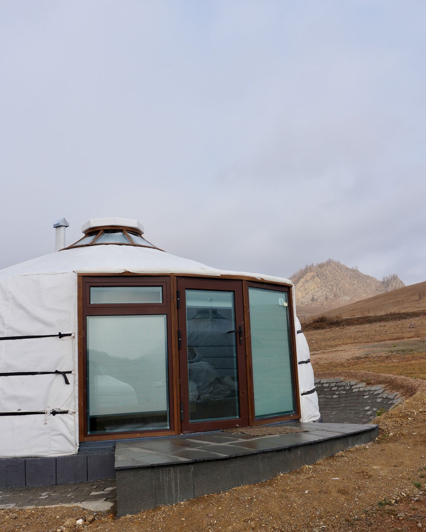A modern Mongolian ger on the hillside at Big Sky
