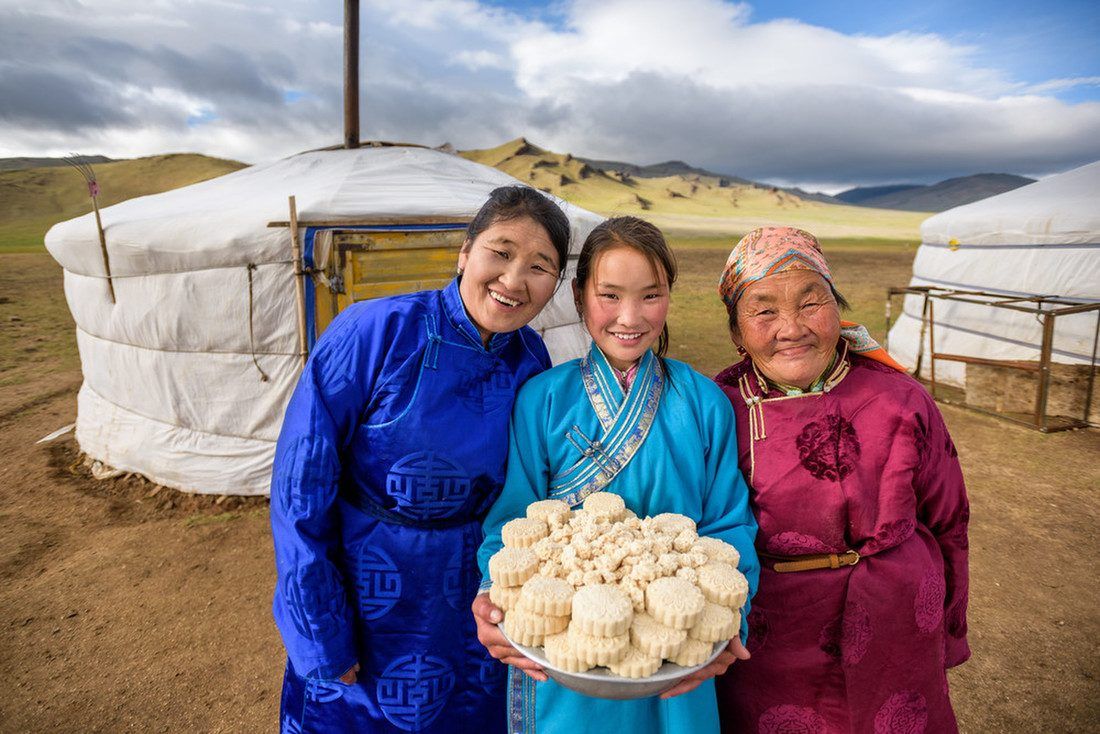 A herder family with horses and tea